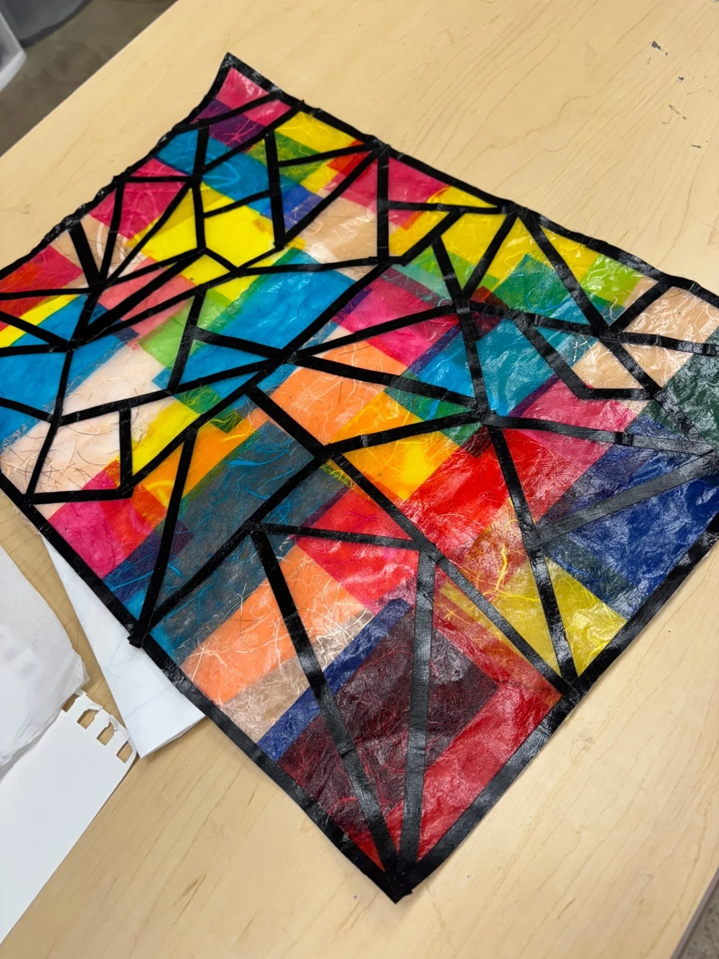 Our Arts for Veterans program attendees worked last week to create stained glass effects with tissue paper and mod podge in preparation for an upcoming stained glass class. Some people worked on other unfinished projects while their work was drying.&
