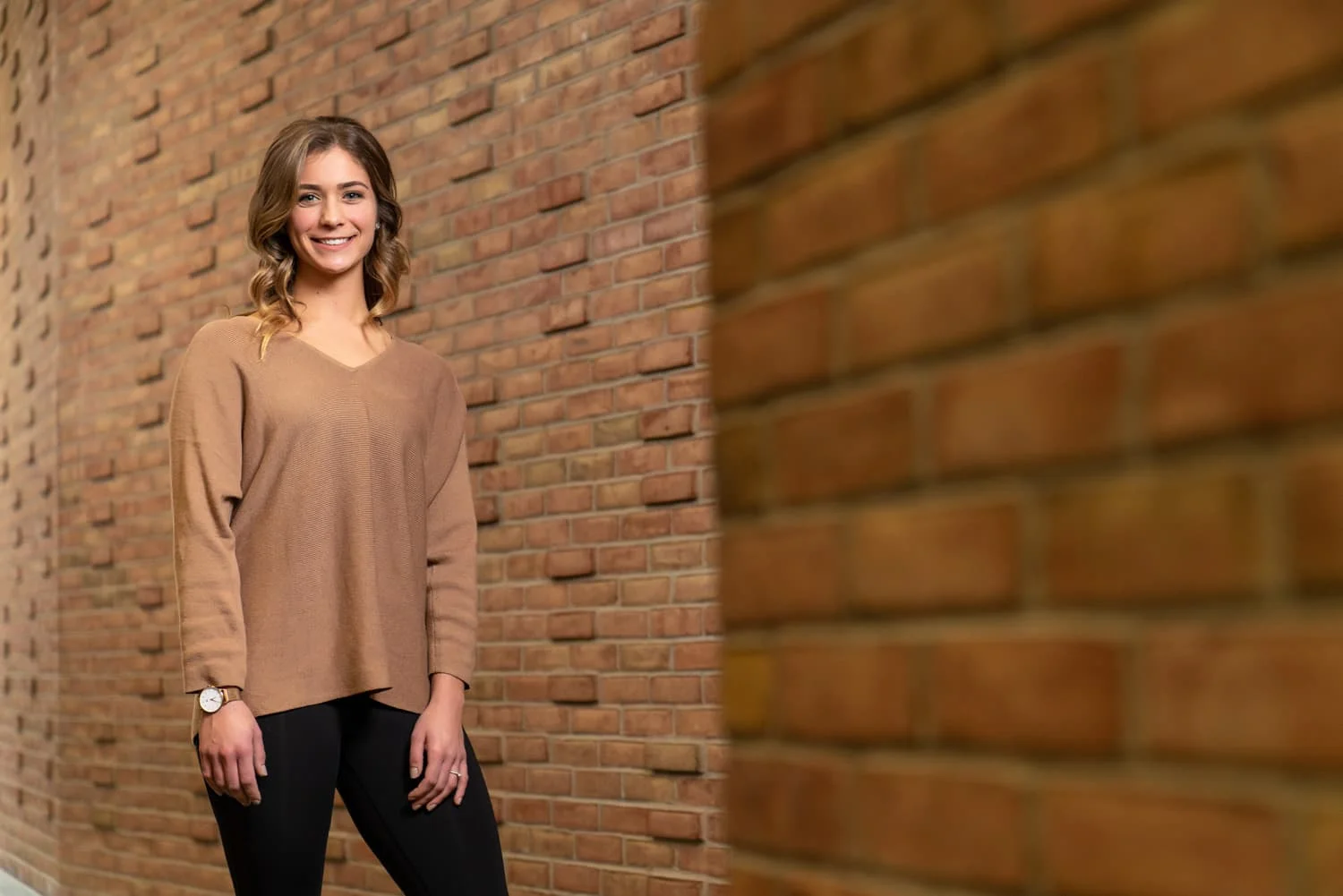 Student portrait near bricks
