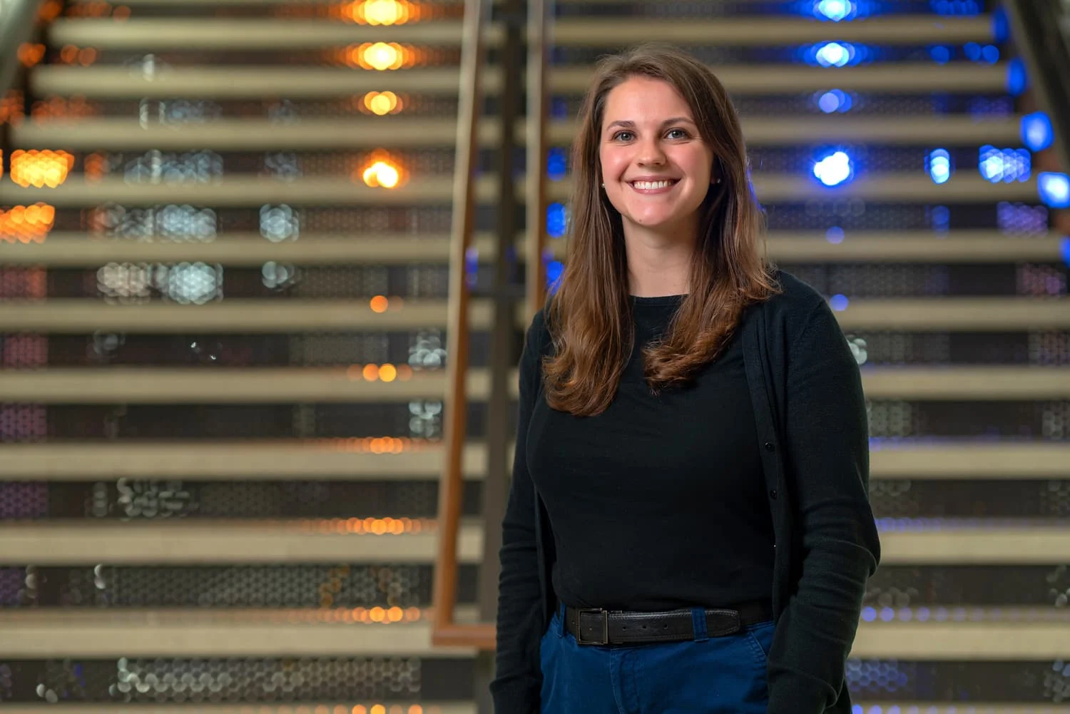 portrait of advisor in front of stairs