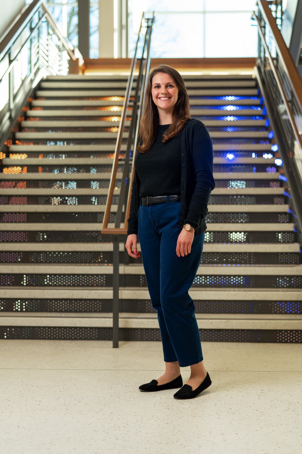  portrait of advisor in front of stairs 