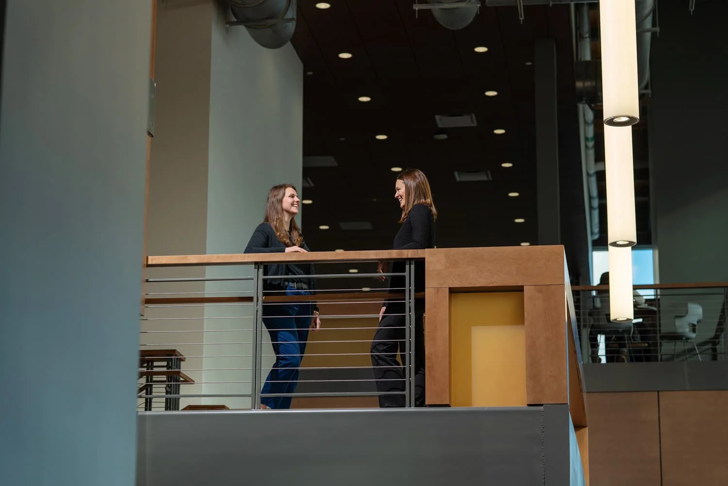 two people talking in industrial building