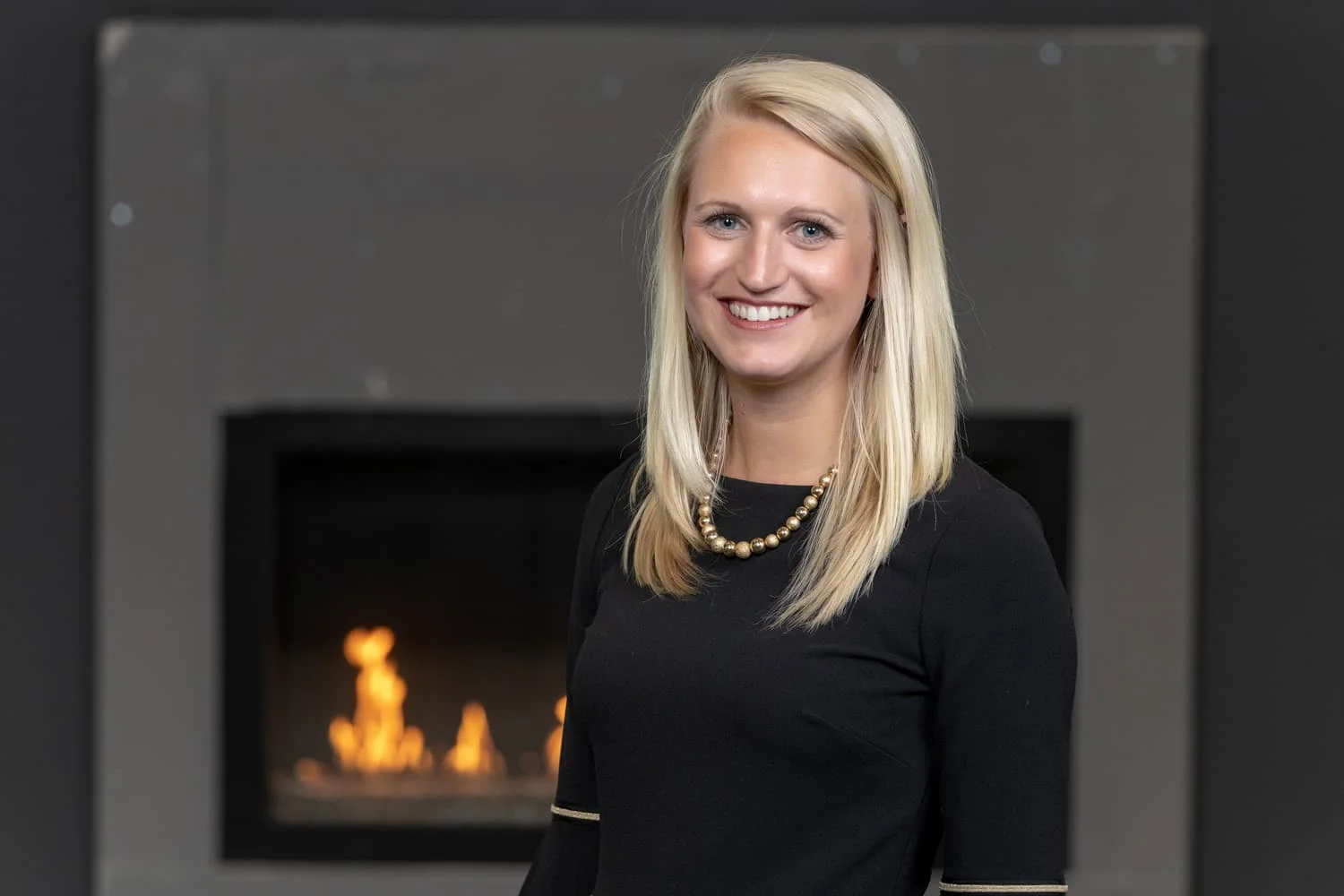 Headshot in front of fireplace