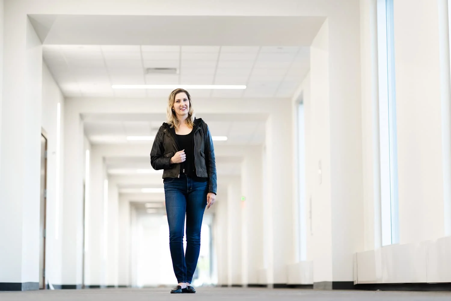 student in white hallway