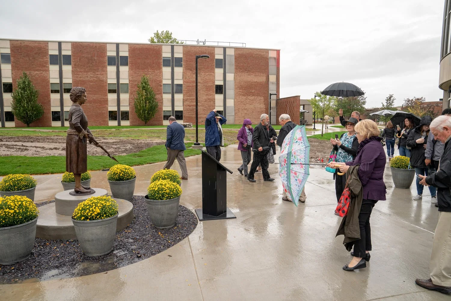 Attendees of the unveiling looking at Matilda Wilson statue