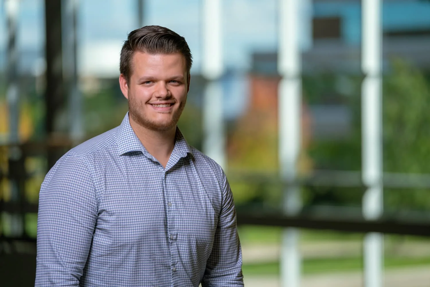 portrait of student with windows in background