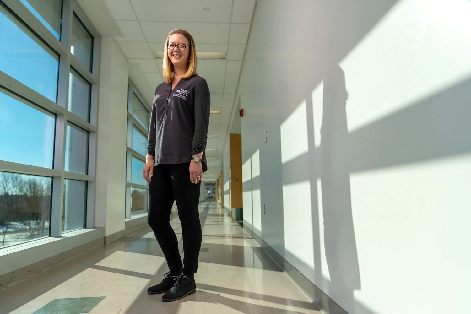 Oakland University advisor standing in hallway