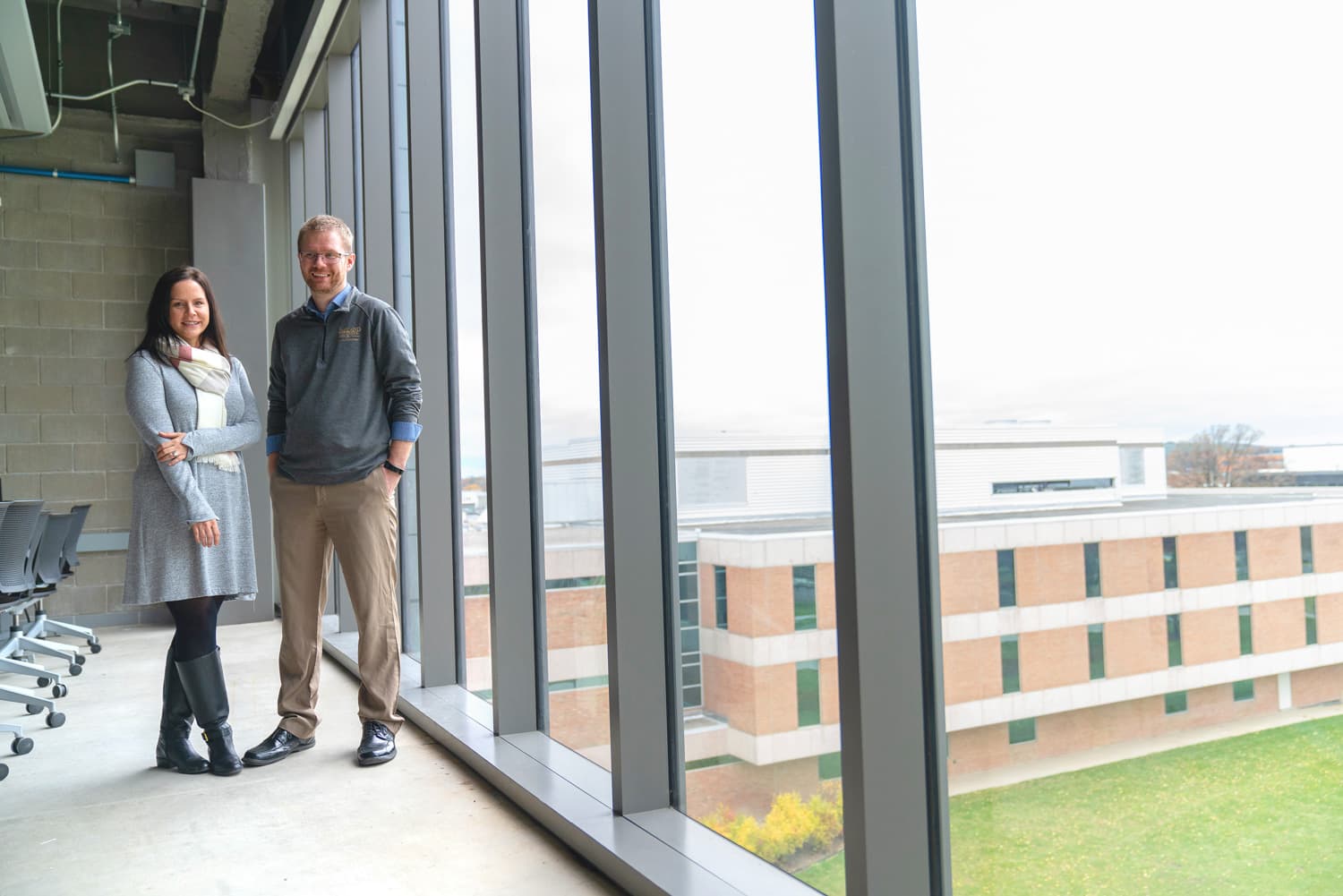  Editorial photography of two colleagues in computer lab 