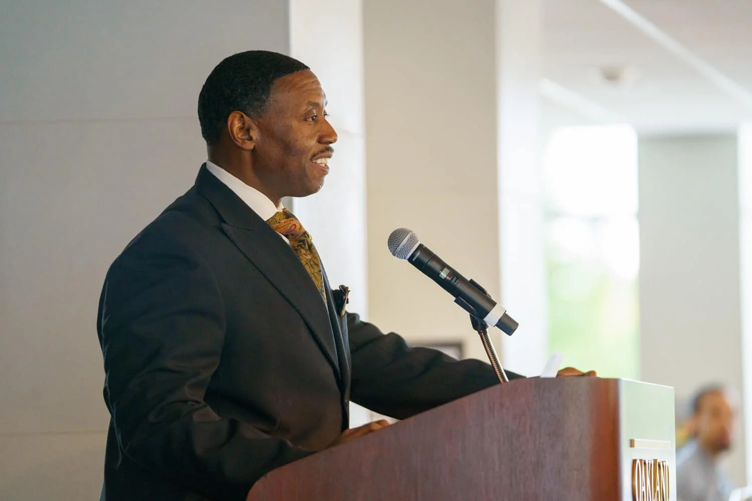 Glenn McIntosh speaking at podium