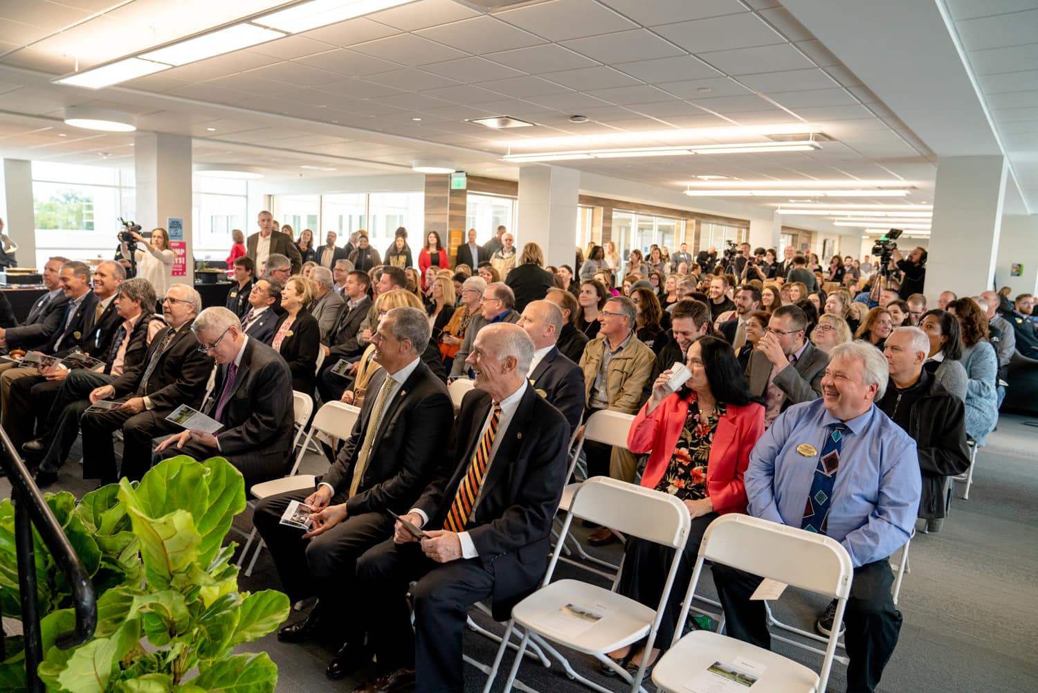  Crowd listening to speakers at grand opening of hillcrest hall at Oakland University   