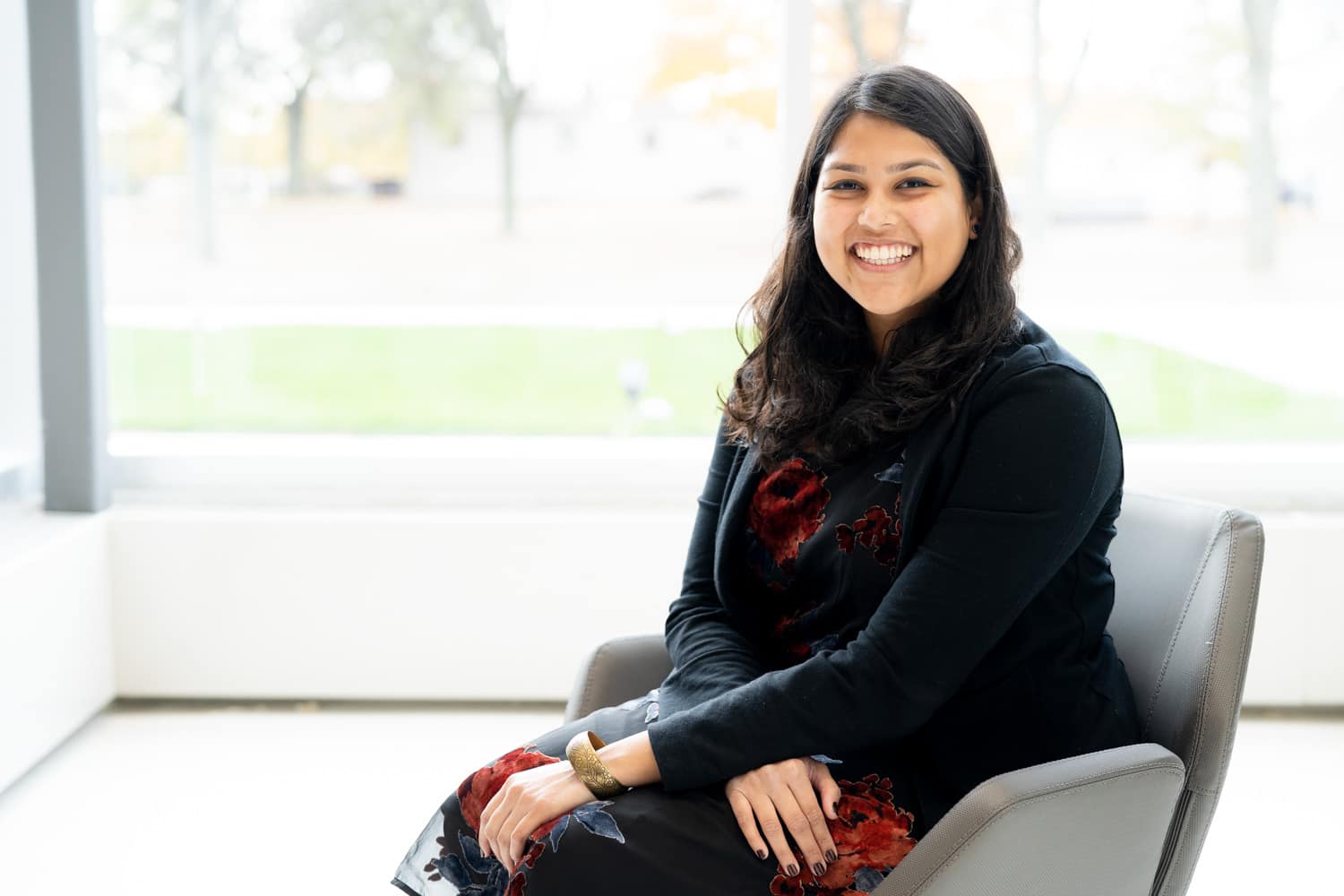  student sitting in chair smiling   