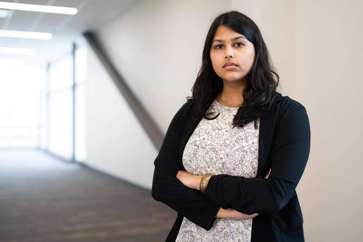  student standing with crossed arms 