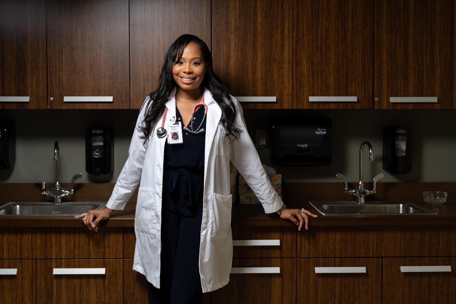  nurse practitioner in front of cabinets 