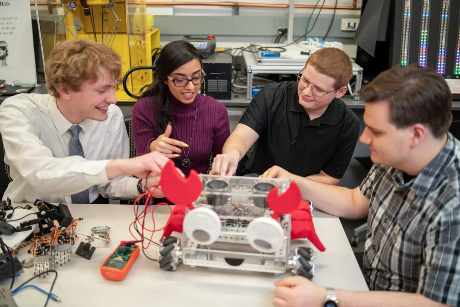 4 students working on a robot