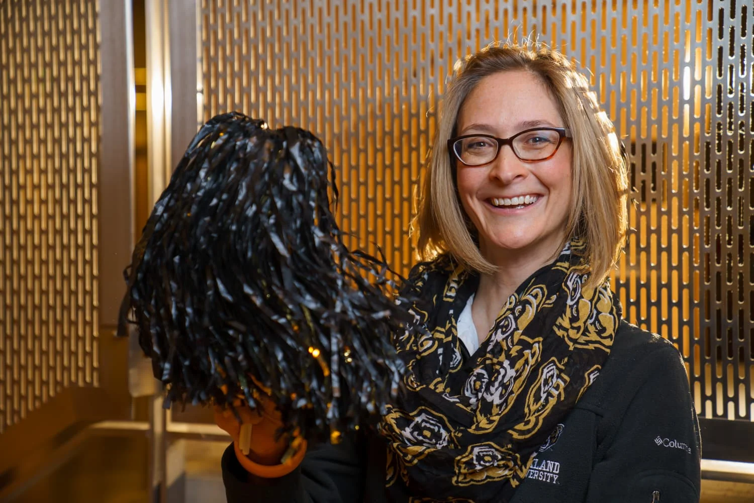 woman shaking a pom pom