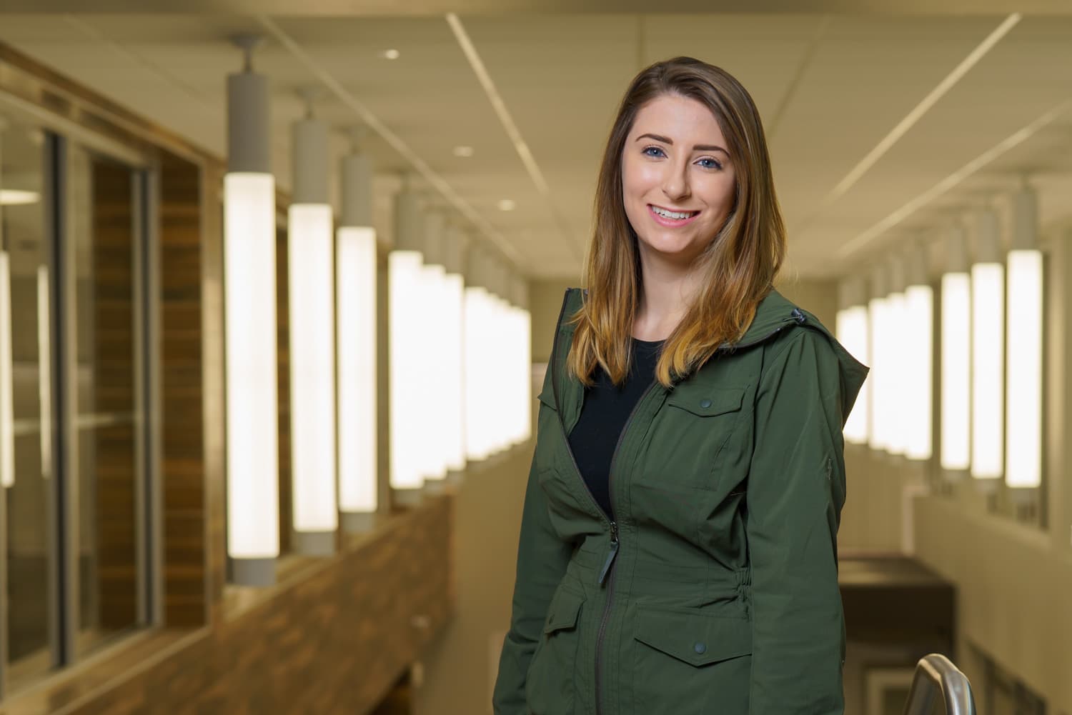  student portrait in front of row of lights 