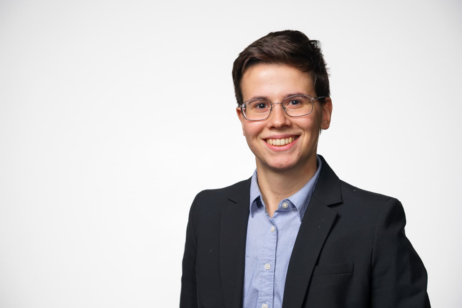  portrait of student in blue shirt and black jacket 