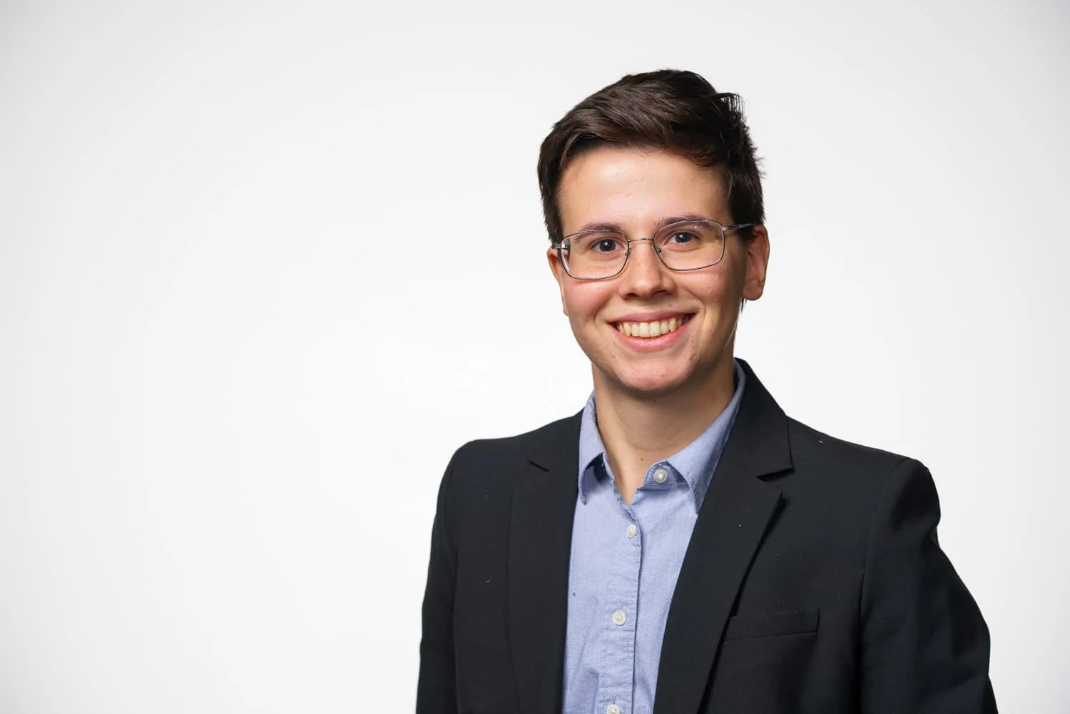 portrait of student in blue shirt and black jacket