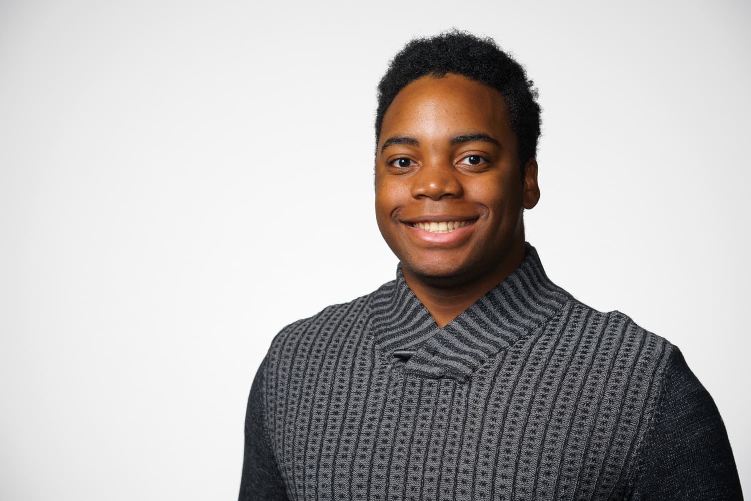  portrait of student in gray sweater 