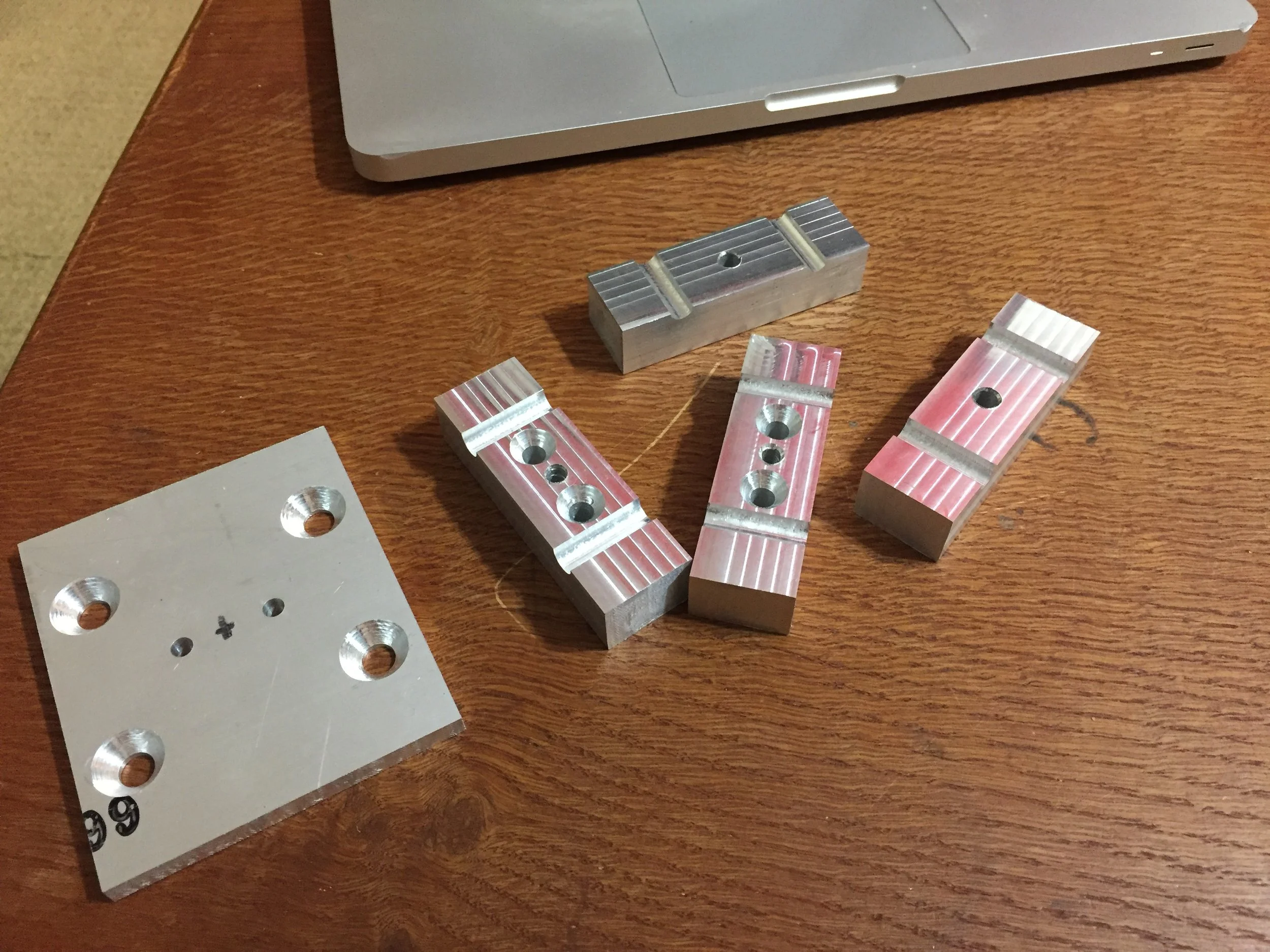 CNC machined components for rail testing jig