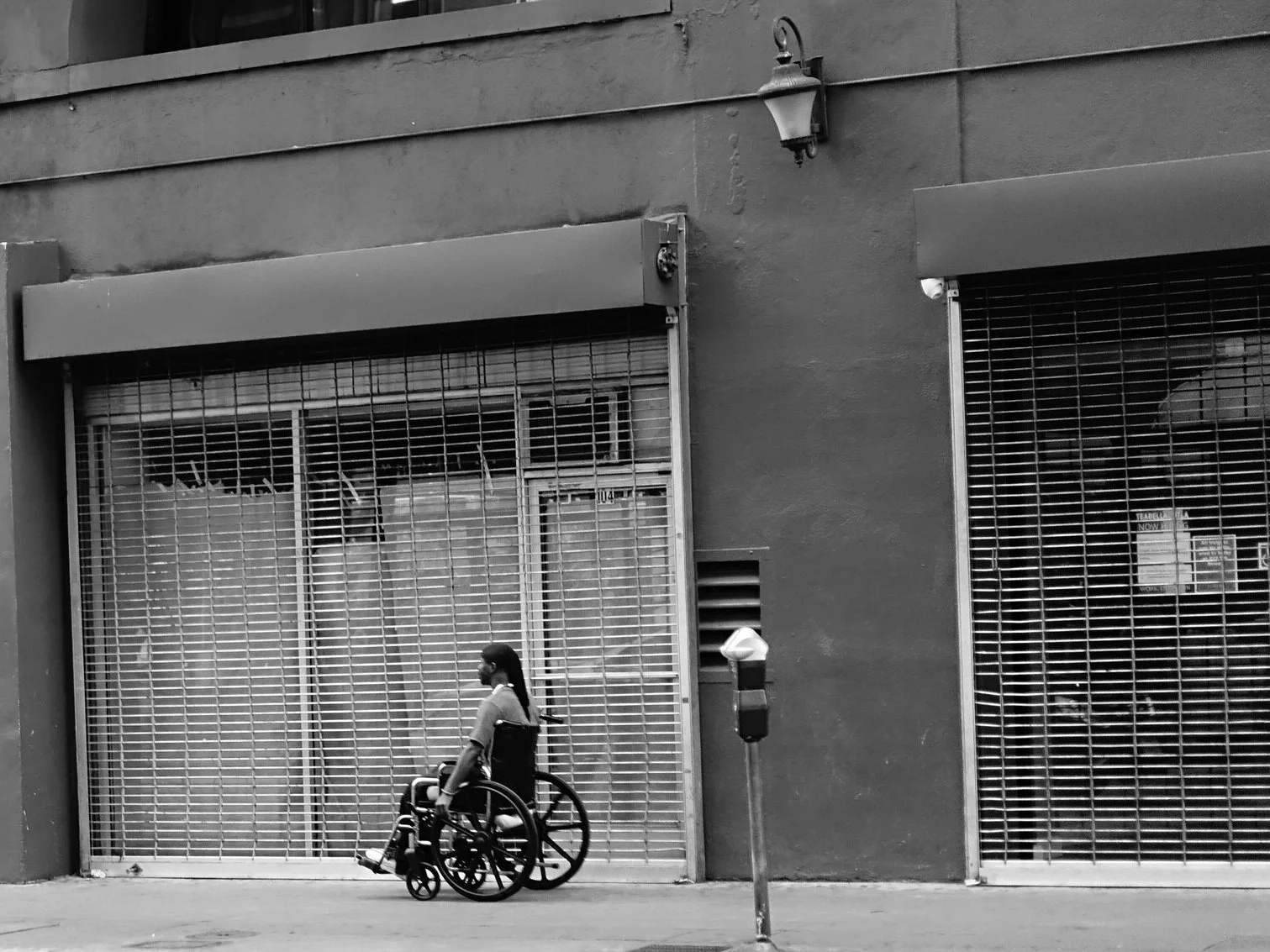 Person in wheelchair, Downtown Los Angeles, USA
