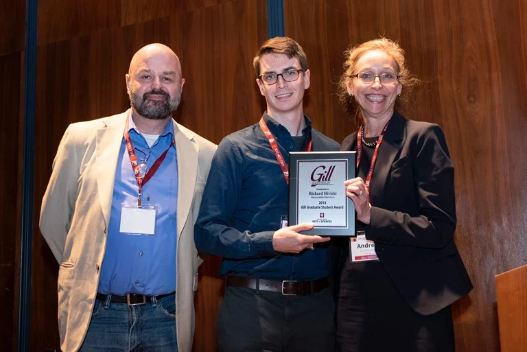 Dr. Dan Tracey presenting the 2018 Gill Graduate Student Honorable Mention award to Dr. Richard Slivicki. Pictured with Dr. Andrea Hohmann,