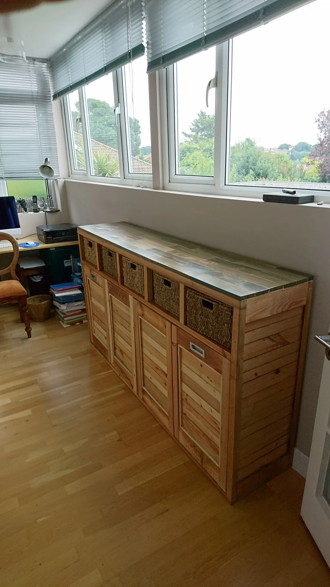  This piece has bi- fold doors,and has incorporated the clients own baskets and has a hardwood top 