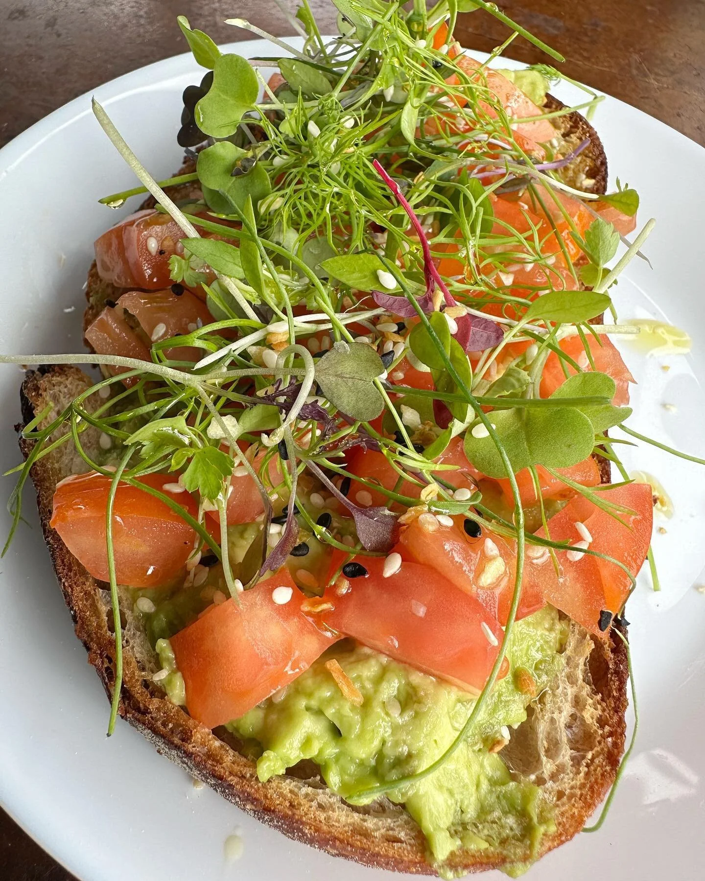 Avocado Toast Petite Style 
Levain bread + avocado + tomatoes + everything seasoning + micro greens (mix of mizuna, cabbage, kale, and kohlrabi) 
We recommend adding an egg 😉 

#petitemadeline #avocadotoast #pmb #oceanside #california #avocado #bake