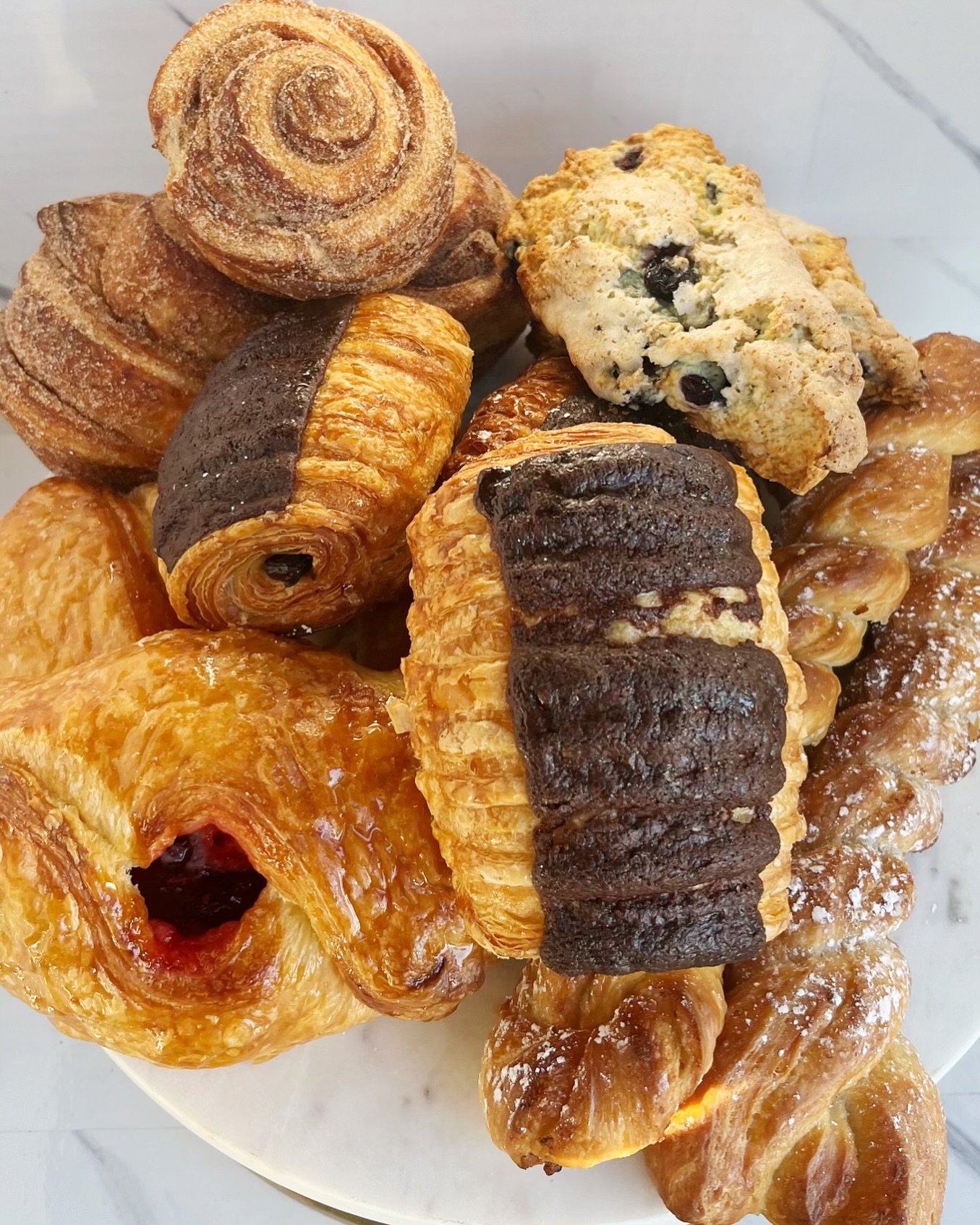 You have 4️⃣ more days to pre-order for Mother&rsquo;s Day!!! Order today before we sell out - Link is in our bio ⬆️ 

This is our Pastry Box (12)
3 all day buns, 2 raspberry cheese croissants, 2 pecan twists, 3 chocolatines, 2 scones du jour $46 
Th