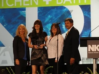 Linn's Kitchen's designer, Allison McCowan, pictured second from the left, received the first ever #1 in the nation award for budget friendly kitchen design. This design was presented on stage in Las Vegas during the 2011 Kitchen and Bath Business Tradeshow.