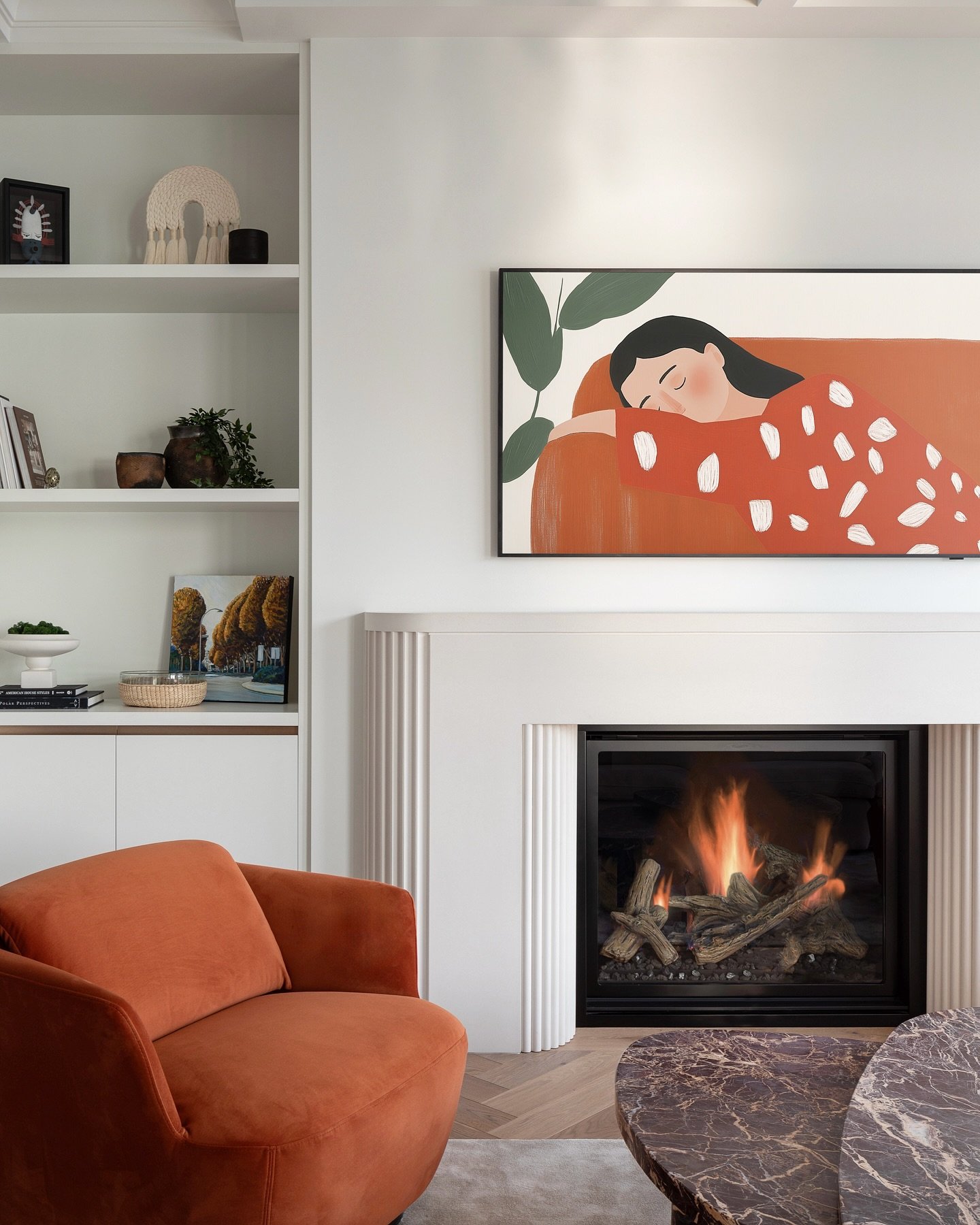Custom designed fireplace surround with opposing flutes&mdash;concave on the outer legs, convex around the firebox. Clean, balanced, and handcrafted in our signature smooth concrete finish. Reach out to bring thoughtful design like this into your spa