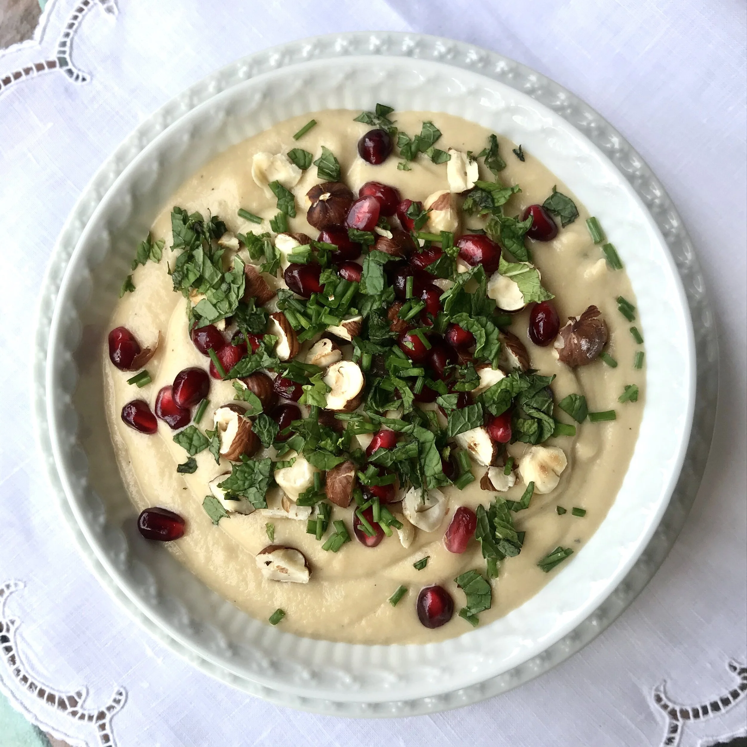 Celeriac Soup with Hazelnuts, Pomegranate Seeds and Herbs