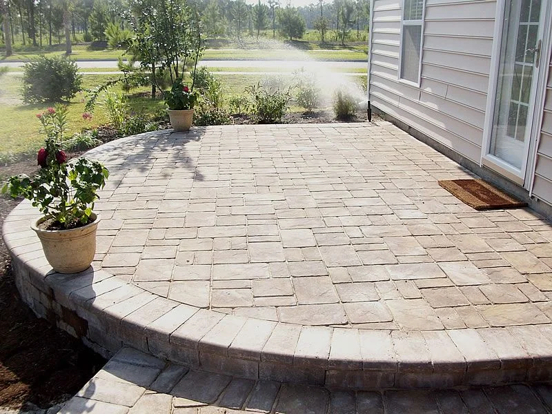 A simple, basic paver patio adds to the curb appeal of new home and requires very little in paver care or maintenance – but offers room to grow.