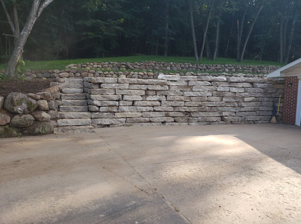 How Retaining Walls Can Help Control Your Sloped Landscape In Monona Wi Design Cottage Grove Patio Driveway Middleton Madison Pond Waunakee - Retaining Wall Steep Driveway