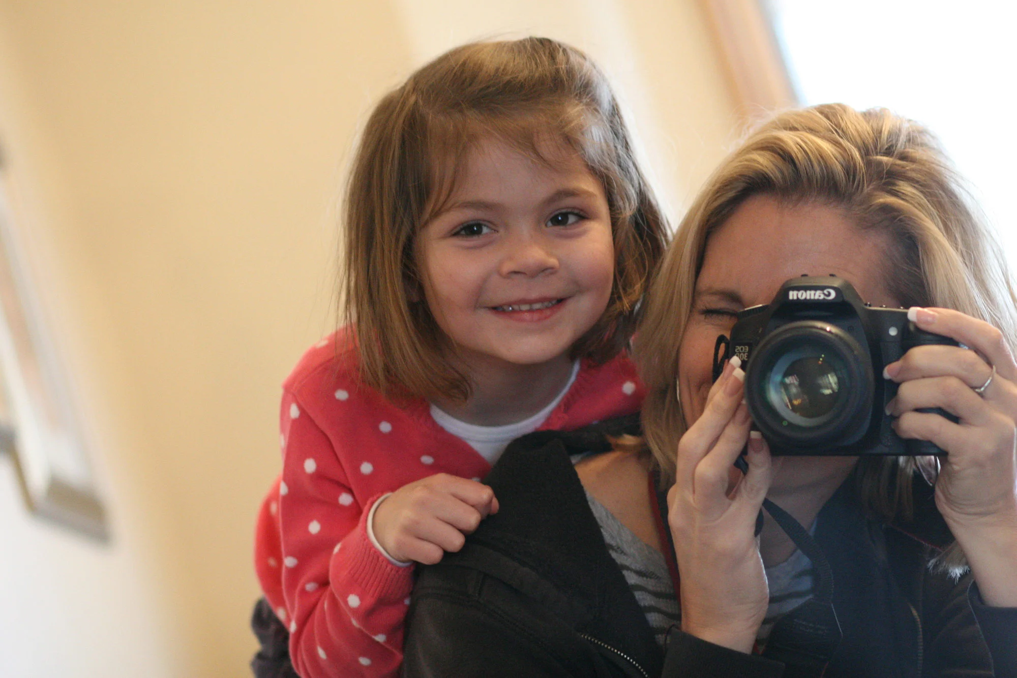 Mother Taking Photo with Daughter on Back  |  LaPanta Photography  |  Family Photos in Shoreview, Minnesota