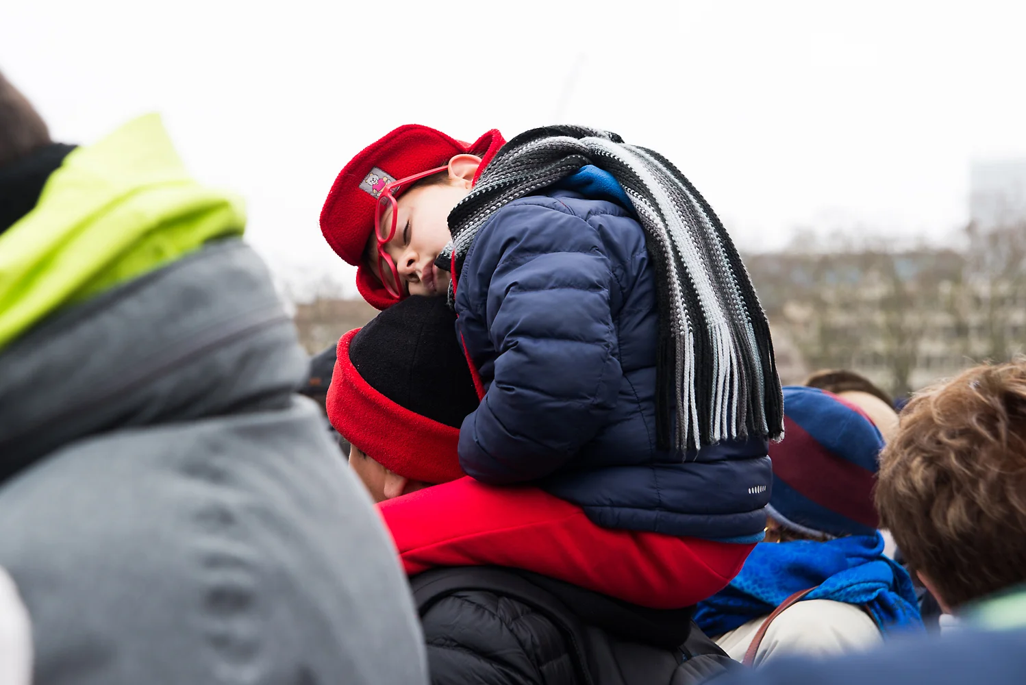 A child sleeps during a Changing the Guard ceremony at Buckingham Palace in London, England on March 18, 2018.