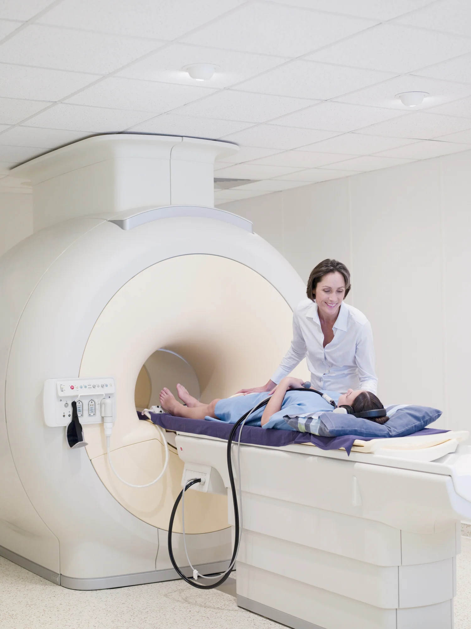 Technician-and-patient-about-to-have-MRI-examination-91156495_1501x2000.jpeg