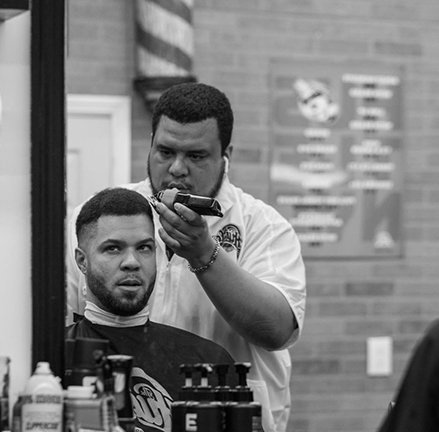 The Hustle Barbershop Queens