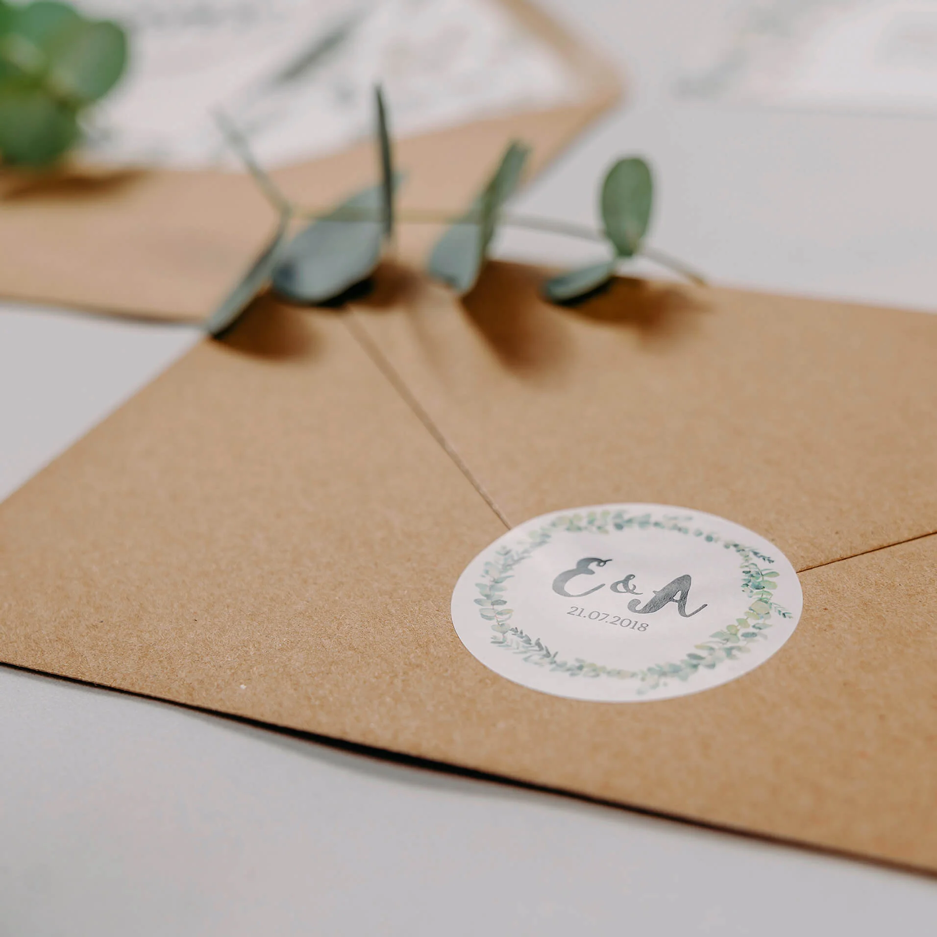 Rustic Green & White Eucalyptus Wedding Invitation Personalised Monogram Circle Sticker On Kraft Brown Envelope
