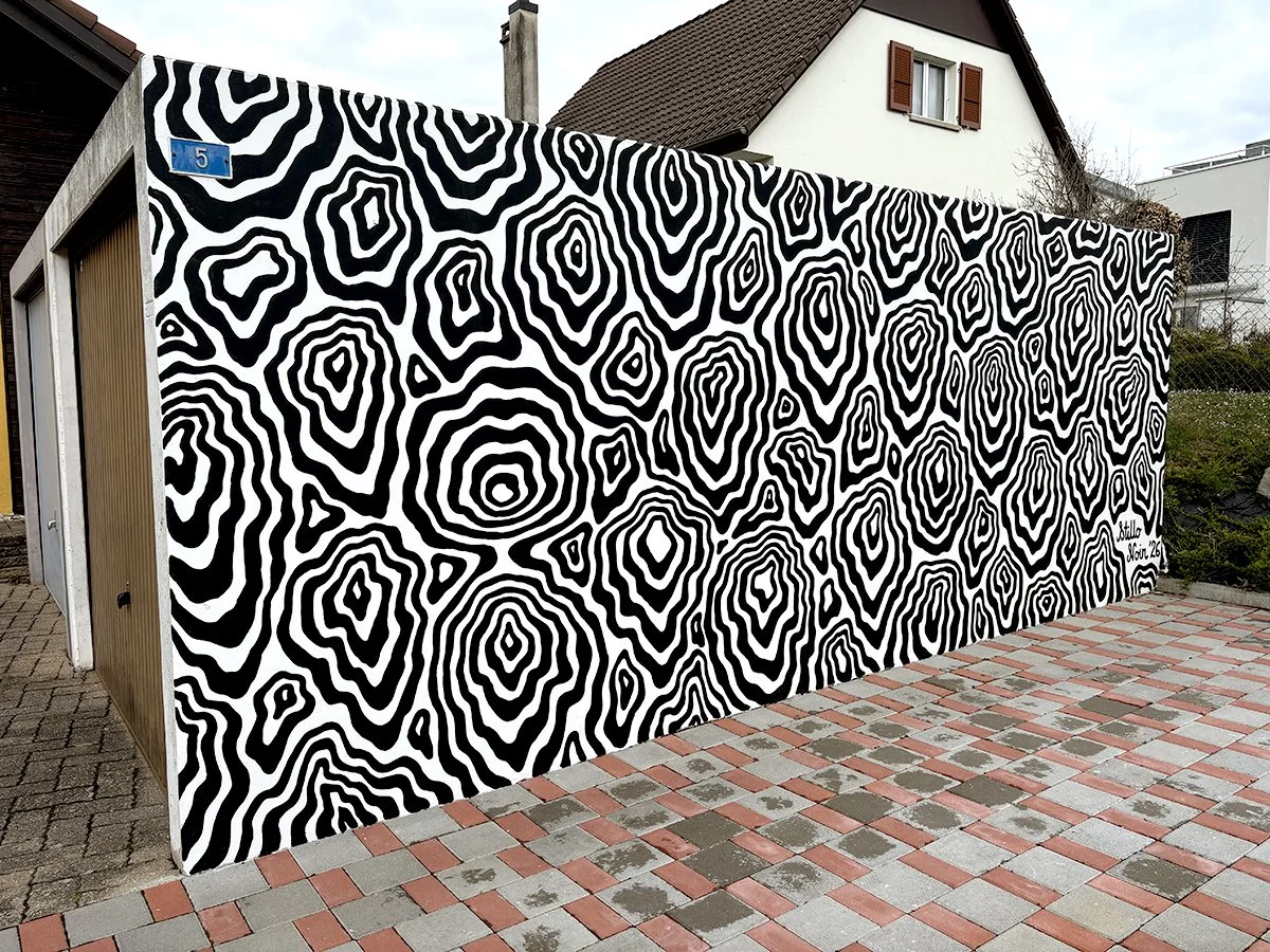 Black and white abstract mural inspired by wood pattern in Switzerland
