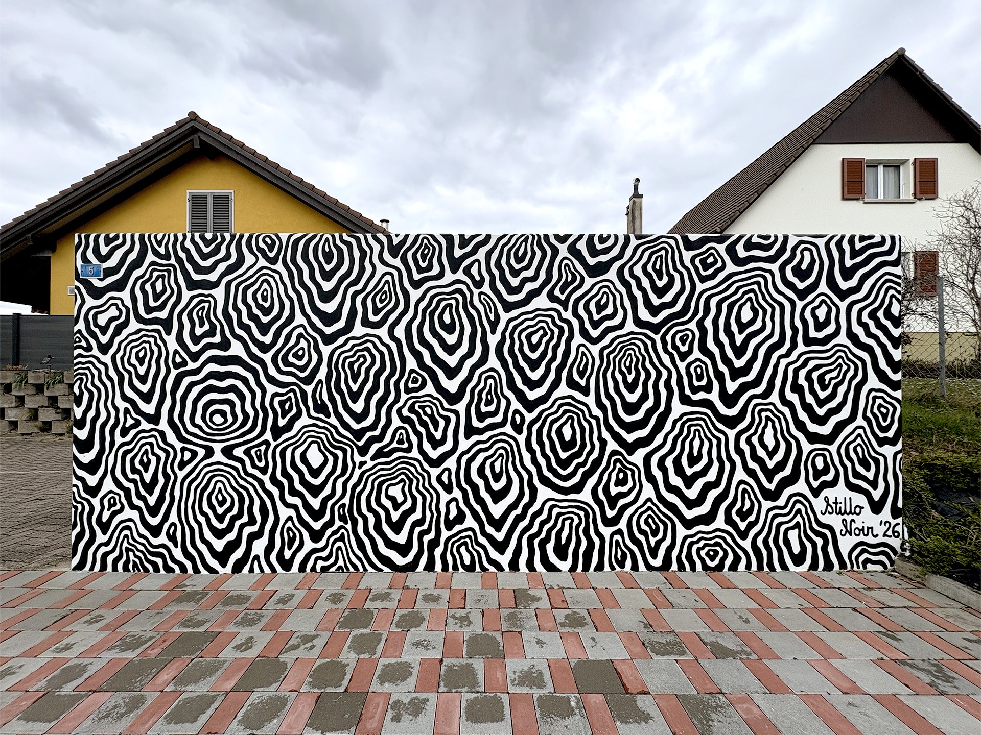 Abstract black and white mural of wood patterns in Switzerland