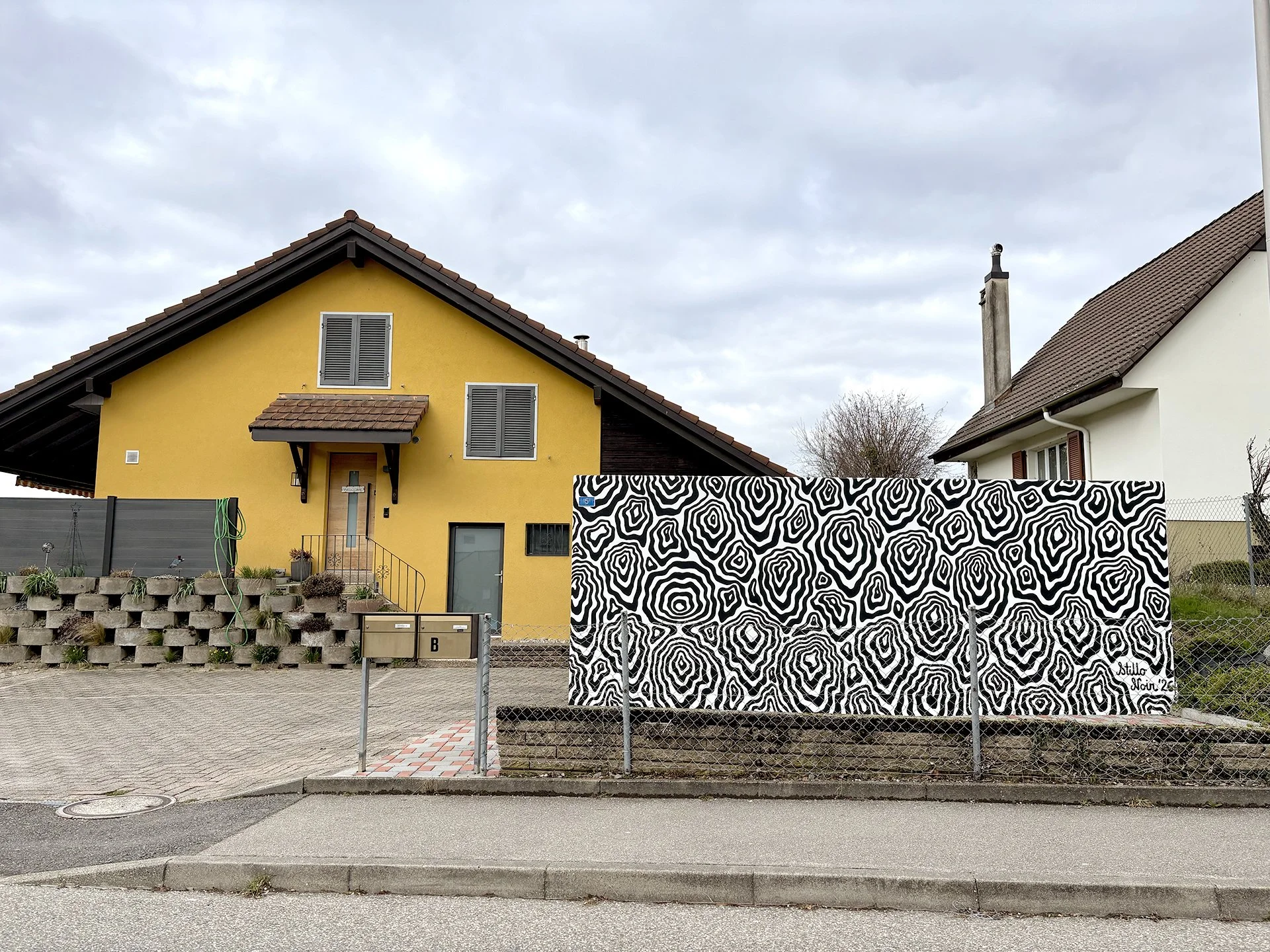 Black and white abstract mural inspired by wood pattern in Switzerland