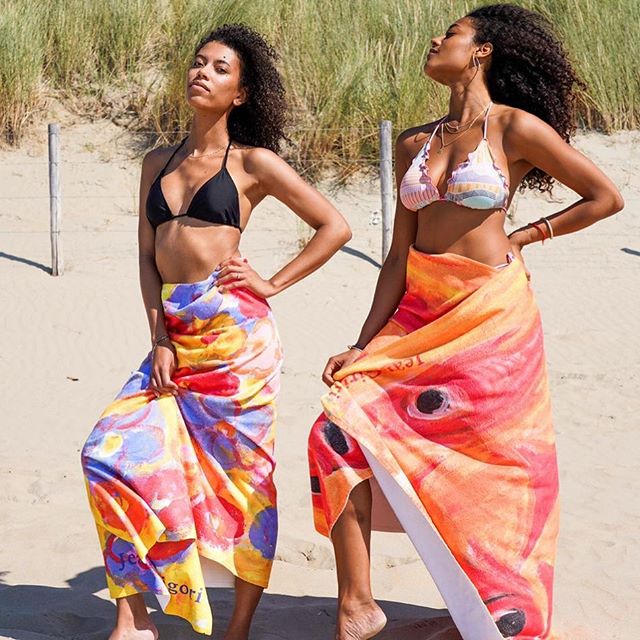 Bikinis, curls and beach towels. And a lot of sun, sea and sand. Ow and don&rsquo;t forget the SPF. The colorful Tempesta beach towel(left) and the strong red Ora di oro(right). Shop your large artistic beach towel now at www.ialdesign.com &bull;
&bu