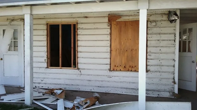 The exterior of Room 2. Vinyl siding removed in preparation for installation of hardie plank siding.