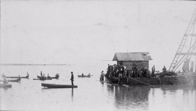 Men in boats - Barnstable Harbor
