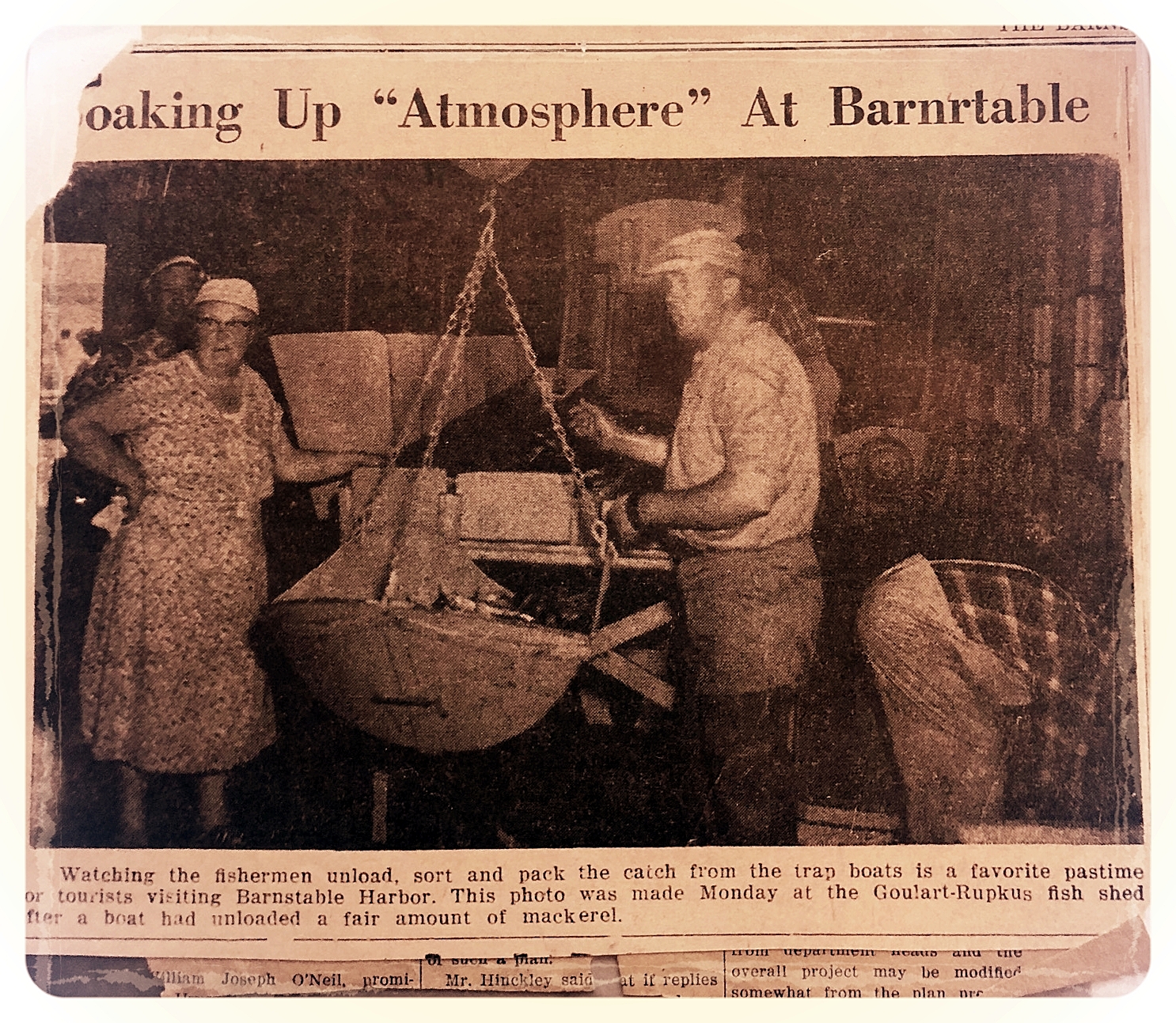 Newspaper clipping with photo of woman buying freshly caught fish from Goulart &amp; Rupkus