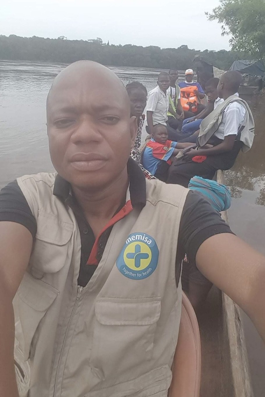 Jean Ilunga crossing the Kwilu River in the Democratic Republic of Congo by canoe after a supervision and financial control mission on behalf of the international NGO Memisa Belgium, 2018 