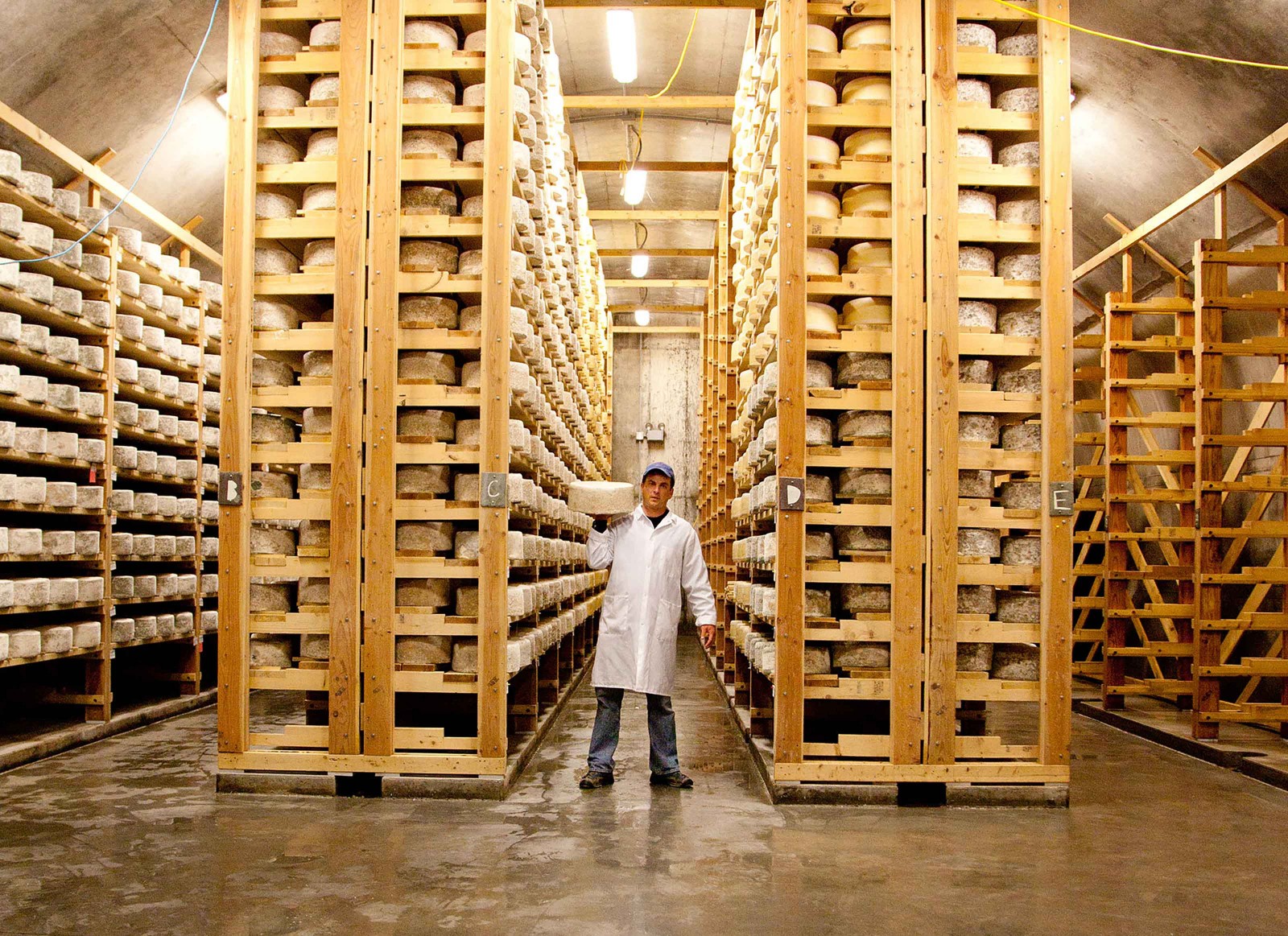 In the cellars at Jasper Hill Farm, cheese from their own creamery and others around the area ripen. The shared space, equipment and collaborative ethos allow many cheesemakers, large and small, to exist in the community.