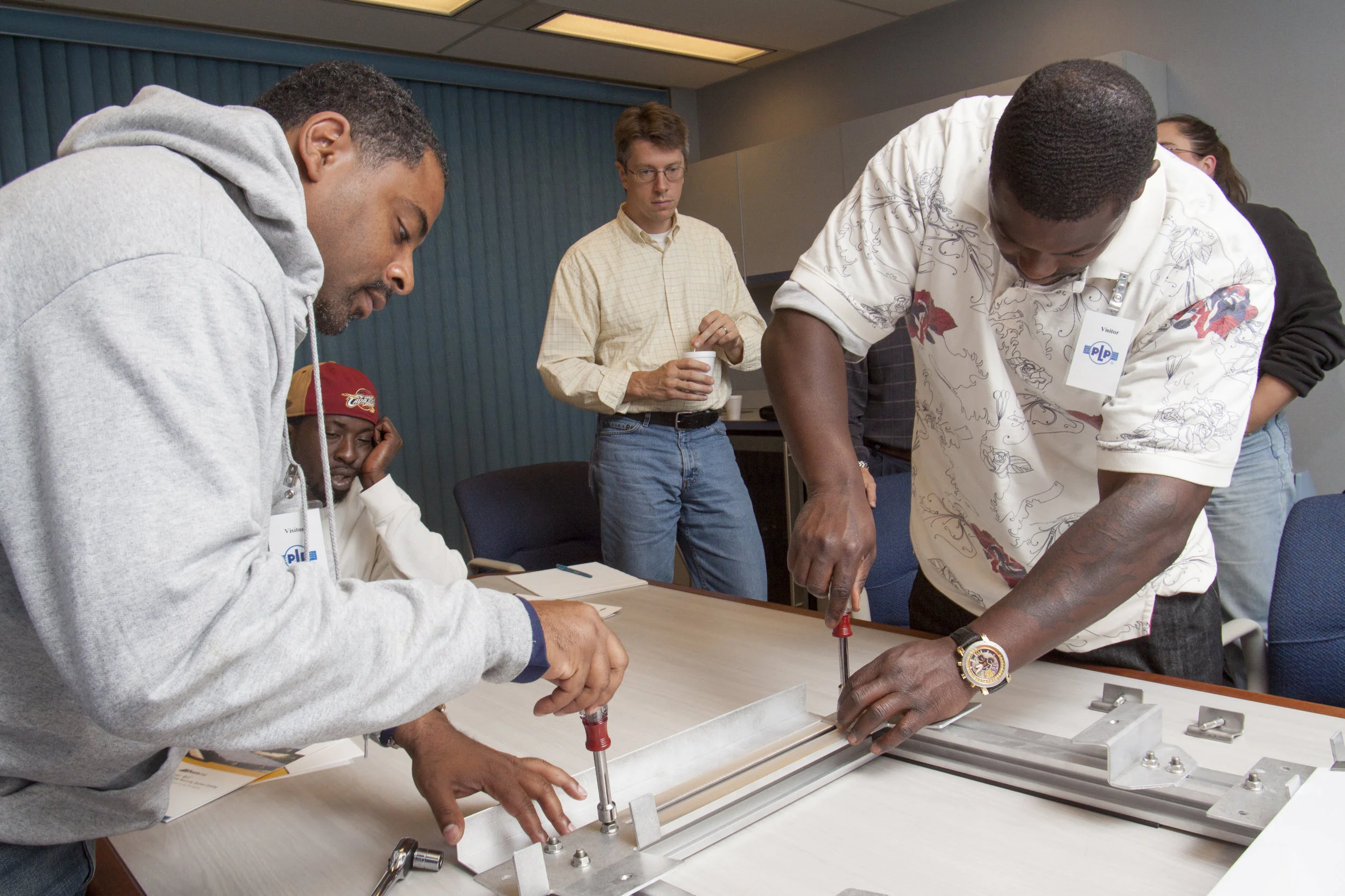 Trainees learn solar installation techniques in preparation for working at Evergreen Energy Solutions, a local cooperative.
