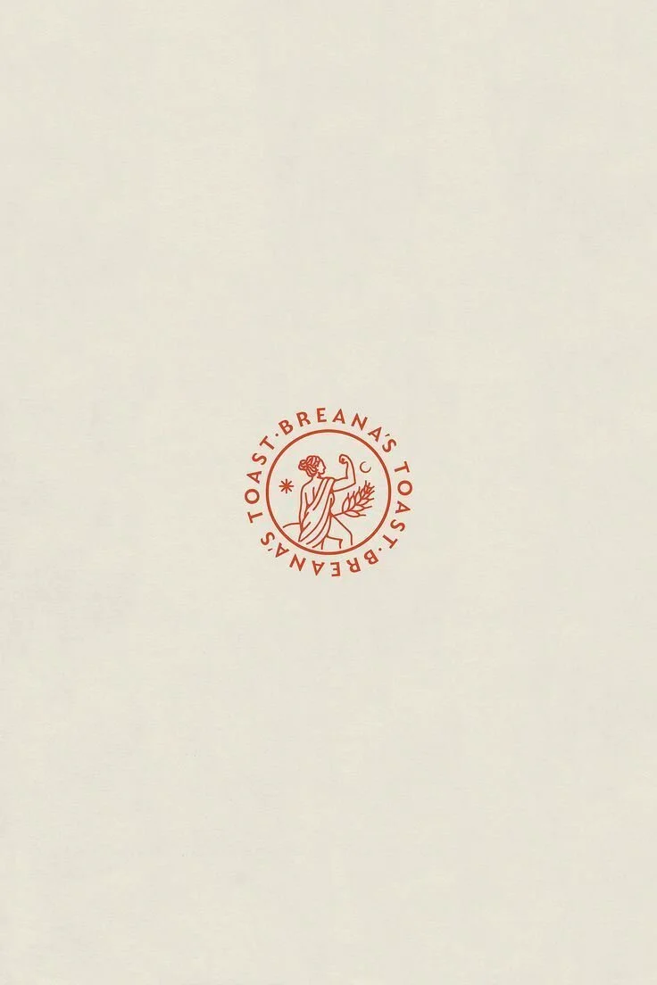 A gorgeous illustrated logo design with hand drawn illustration of a female body, reminiscent of antique greek statues_ Inspired by ancient greek connection to nature, this.jpeg