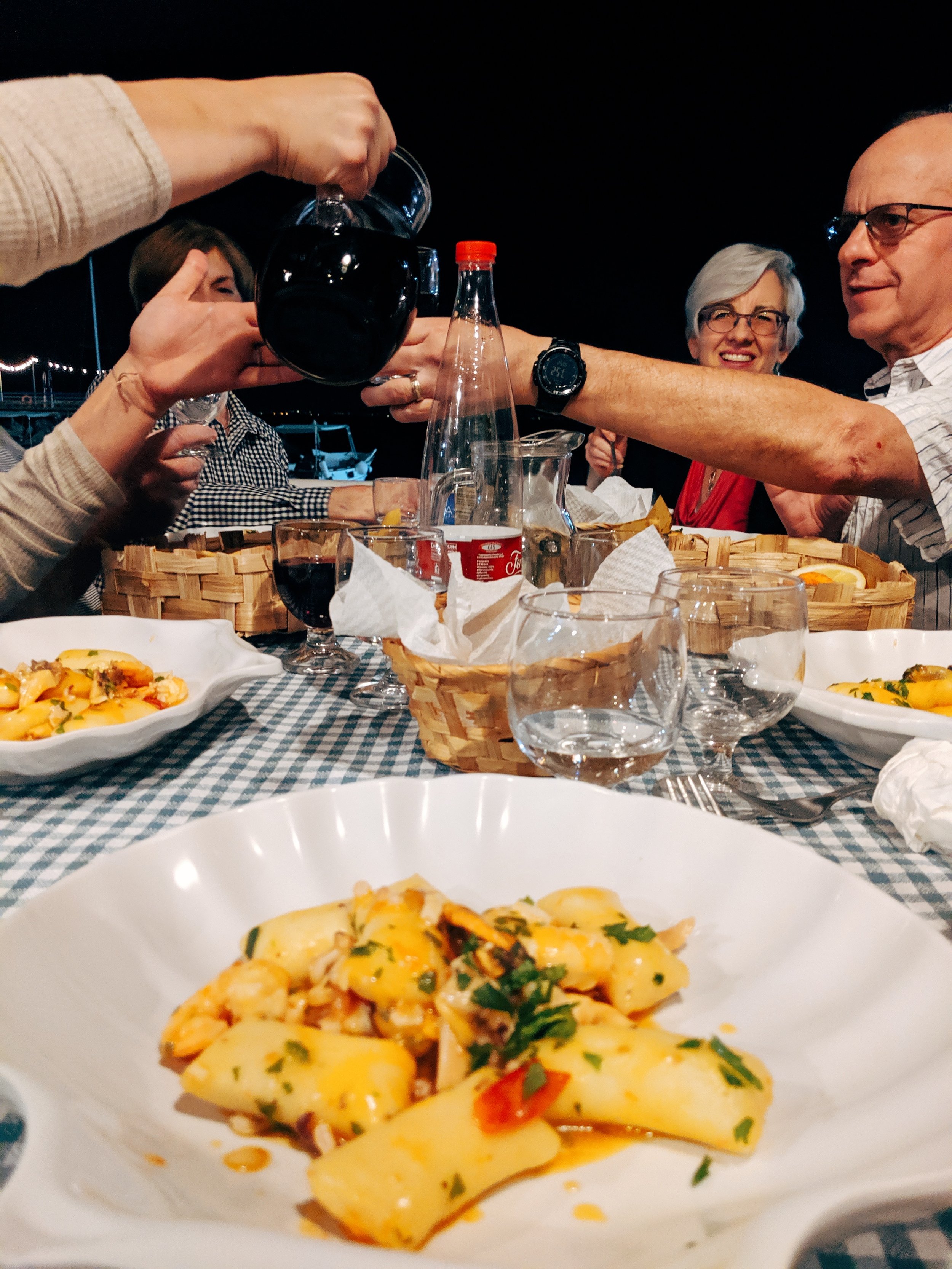 people sharing food across the table